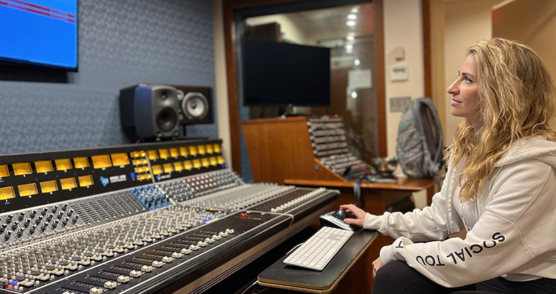 Audio Technology student Tessa working at the control board