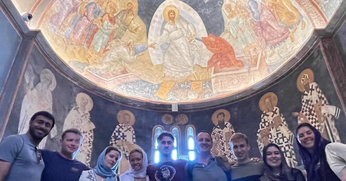 Students and Professor Fedyashin under a Hagia Sophia ceiling fresco.