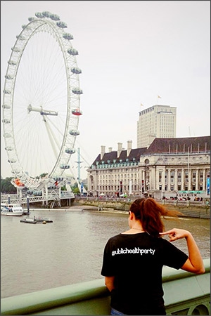 Student next to a Ferris wheel in London