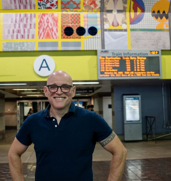 AU art professor Tim Doud with his artwork in DC Union Station.