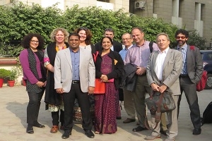 Group of men and women gather outside on a sunny day in Delhi