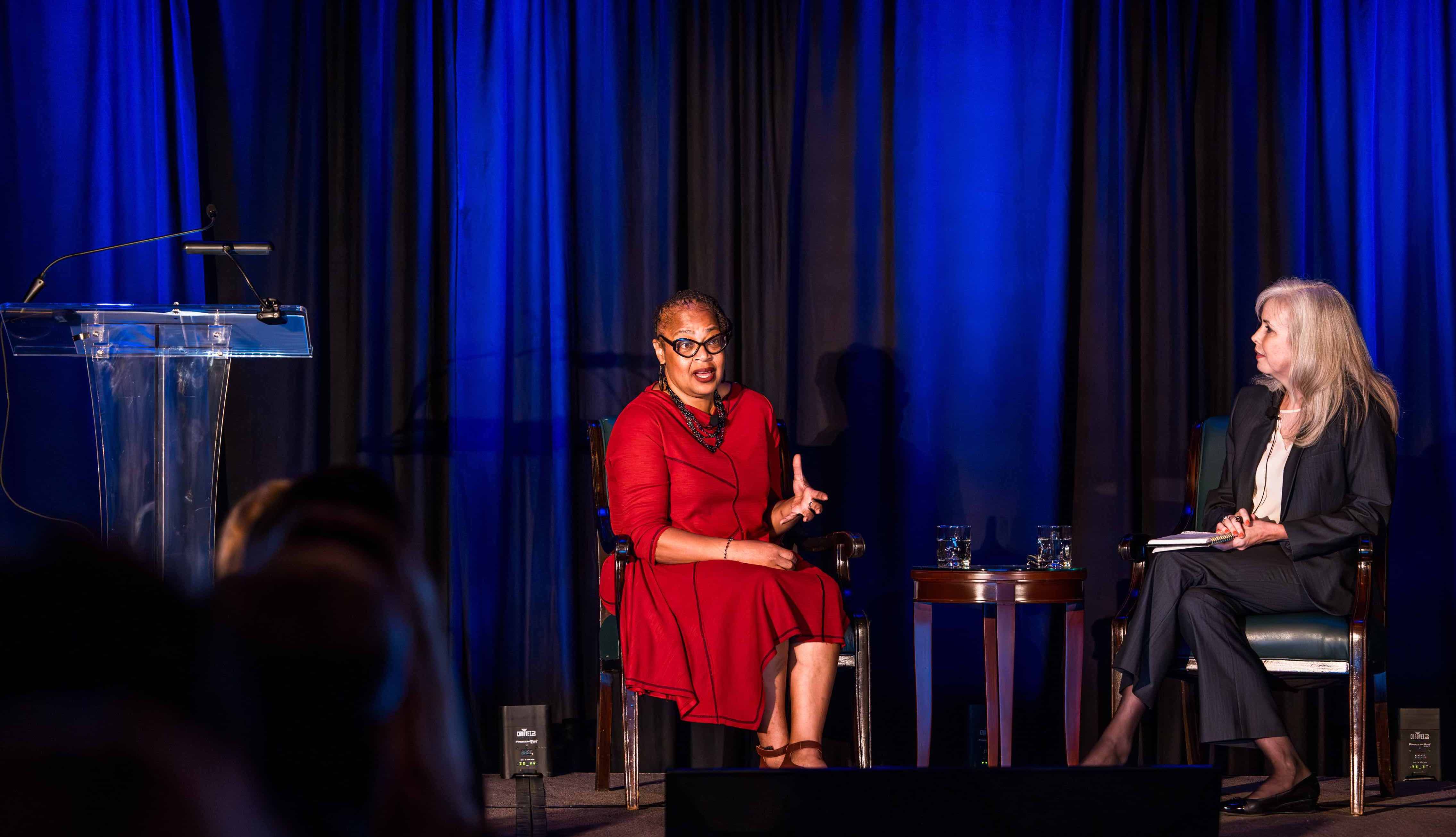 Kogod professor Sonya Grier and Chicago Tribune journalist Kim Quillen seated in conversation onstage at the University Club of Chicago.