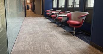 A row of red chairs in the renovated 3rd floor of MGC