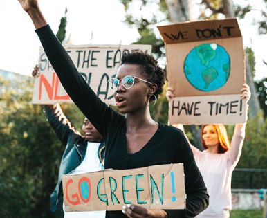 climate activist holding a sign