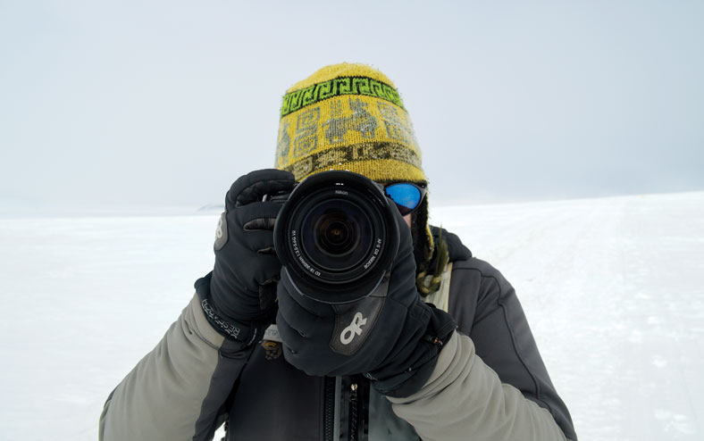 mike lucibella points his nikon at the camera in Antarctica