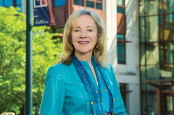 Sherry Lee Mueller in front of AU's School of International Service