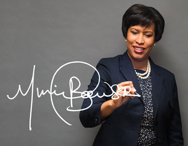 DC Mayor Muriel Bowser signing her name