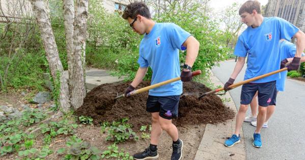 Scooping mulch took place all over campus. Photo by Jeff Watts. 