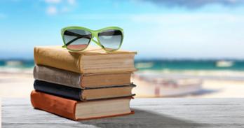 Books on a beach. Getty Images.