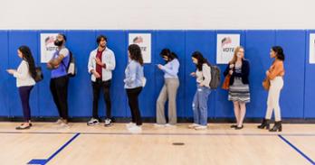 Voters stand in line on election day.