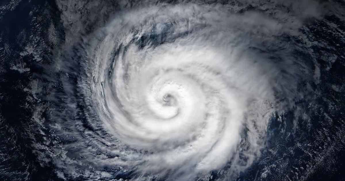 Aerial view of a swirling hurricane over Earth. Photo from Getty.