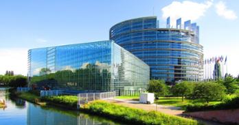 European Parliament building overlooking a river in Strasbourg, France