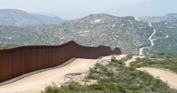 Fence crossing a desert