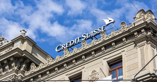 Credit Suisse name on building with sky in background