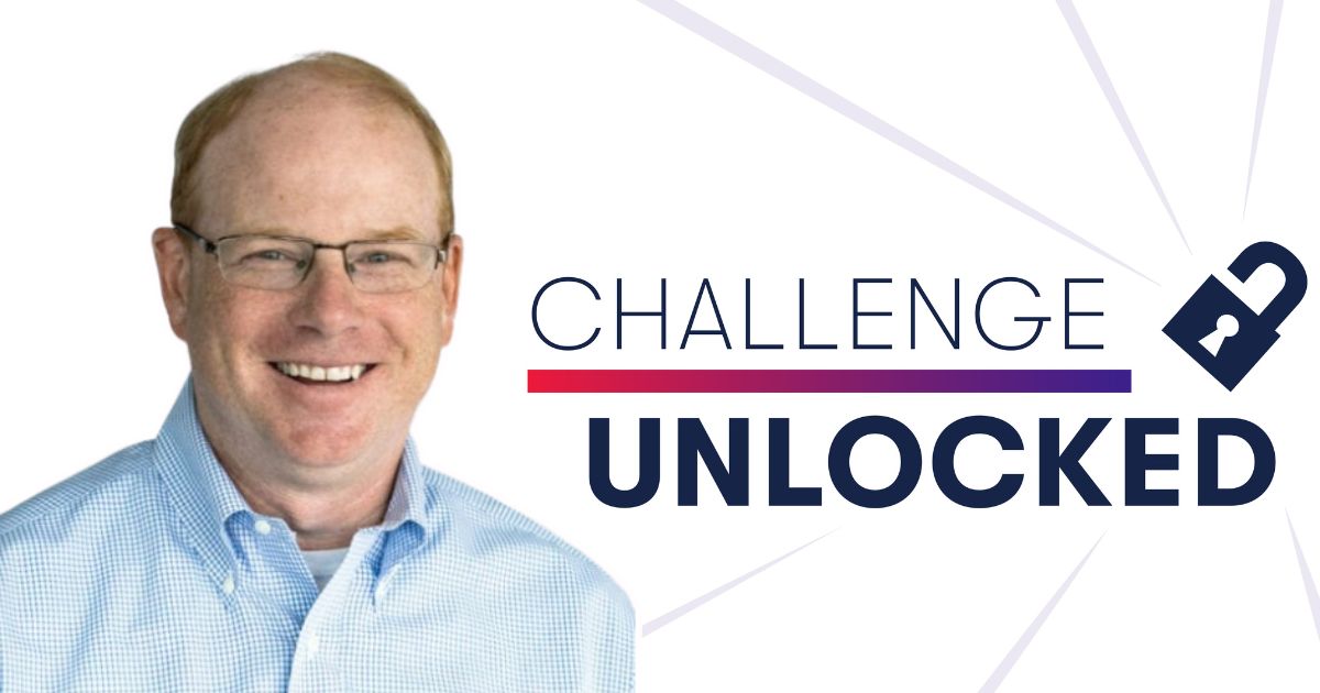 SIS alumnus Matt Klinger is shown beside the words "Challenge Unlocked"