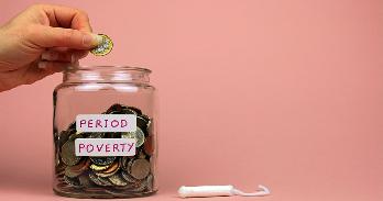 Coin jar labeled "Period Poverty"