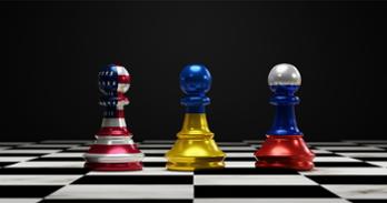 Chess pieces with the American, Ukrainian, and Russian flags