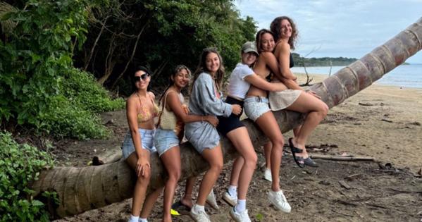 NRSD students sitting on a palm tree in Costa Rica