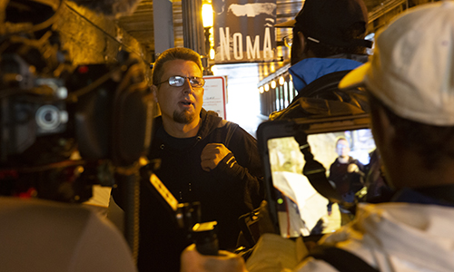 A man being interviewed inside a tunnel