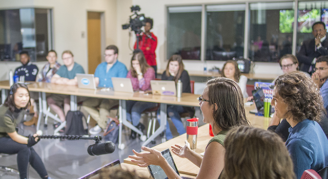 Student talking into a mic during classroom.