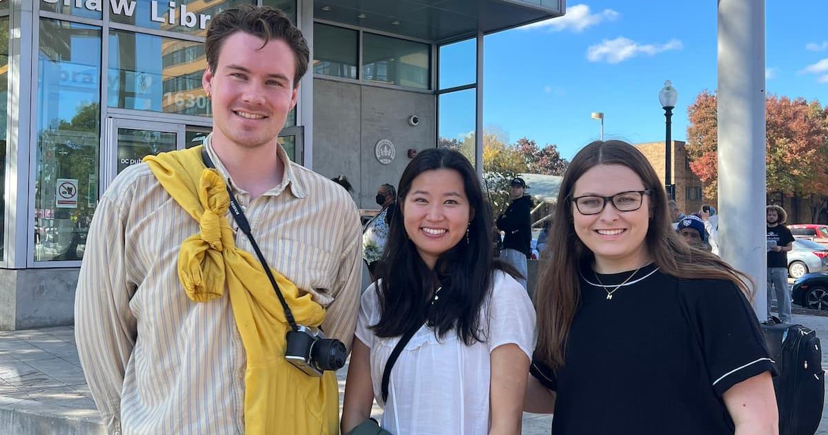  Hauk Fossen, Alexandra Lunstøeng and Maria Lawson stand outside the Shaw Library after talking to voters on Election Day