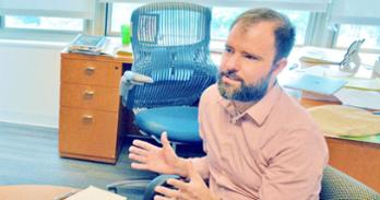 Dr. Robert Shand in his SOE office.