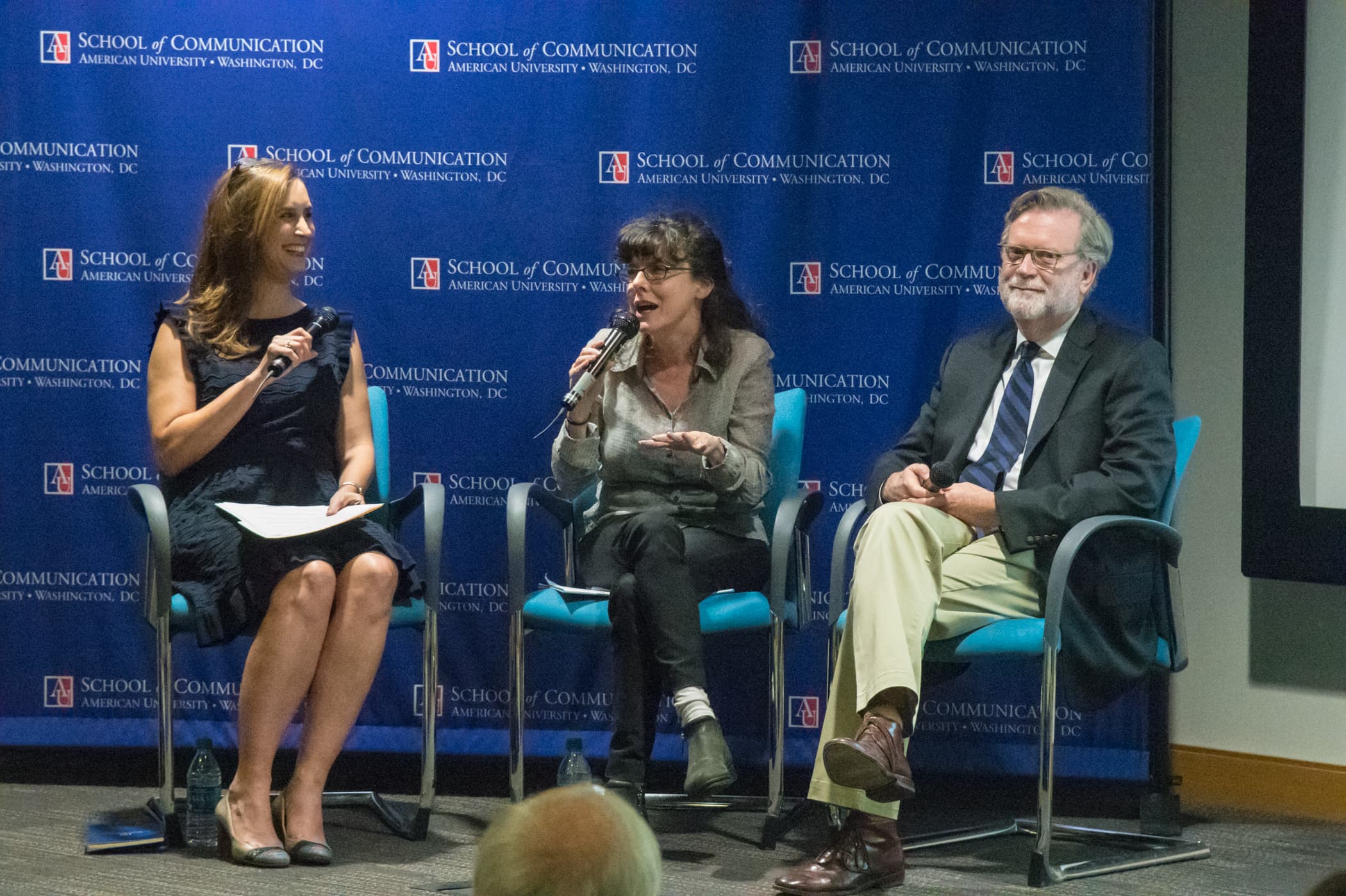 Event panelists sit together.