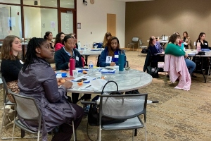 welead students seated at tables