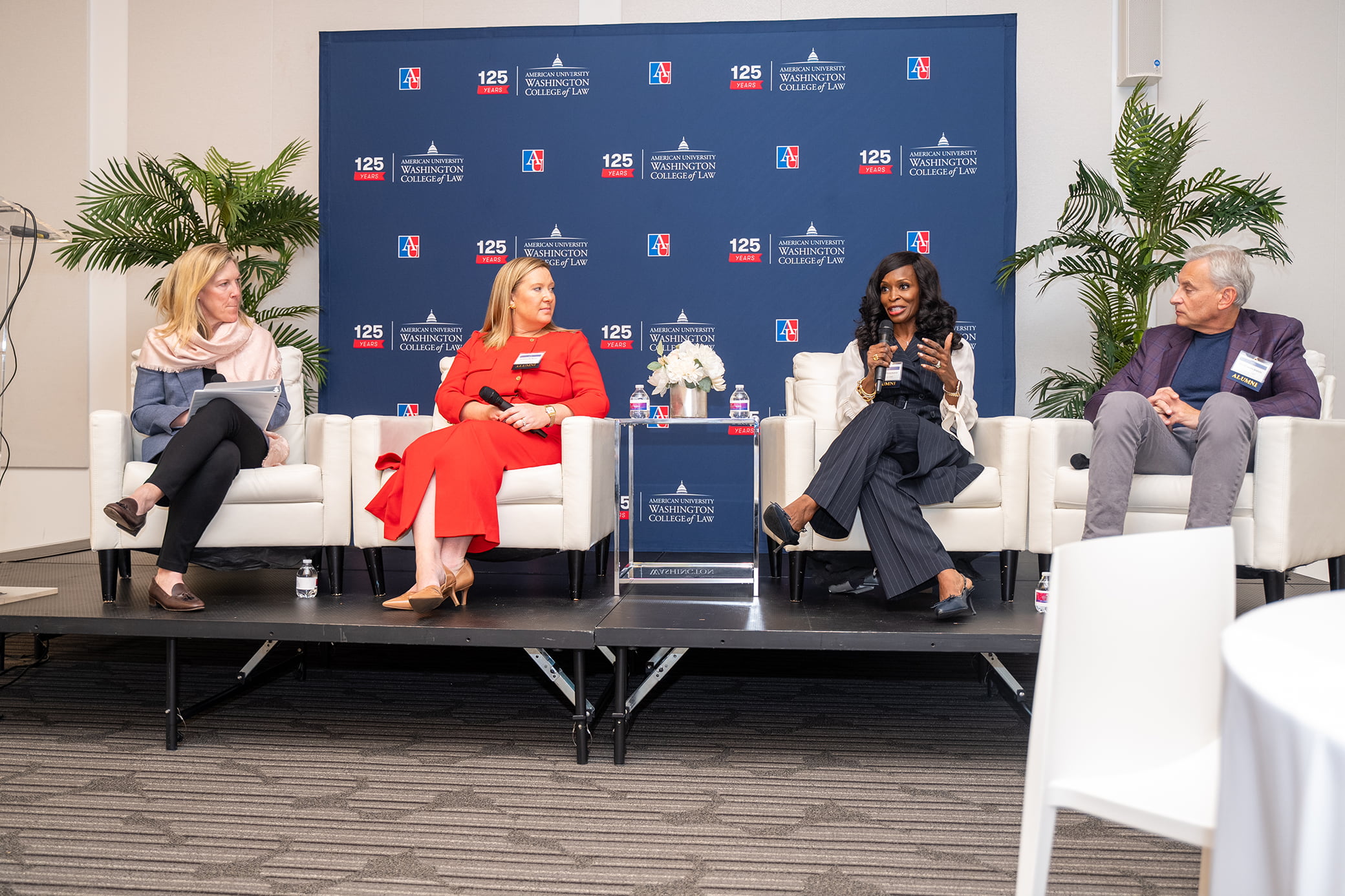 Alumni panel at the 2024 AUWCL Alumni Reunion featuring Interim Dean Heather Hughes (left), Lorna DeRosa '14 (center left), Joiava Philpott '90 (center right), and Jim Cooperman '87 (right).